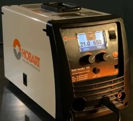 Hobart Multi Handler 200 welder illuminated, a symbol of robust functionality and precision in metalworking.