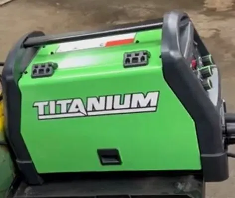 A bright green Titanium MIG 170 welder with clear brand labeling on the side.