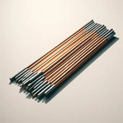 Assorted copper-colored and grey welding rods neatly organized, symbolizing precision in metalwork.